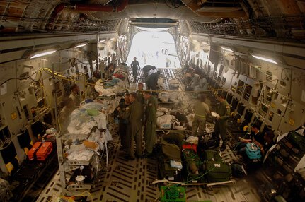 Members of the 615th Contingency Response Wing, Travis Air Force Base, CA, prepare patient for evacuation aboard a C-17 Globemaster III.  Members of the 615th are evacuating civilian out of New Orleans prior to Hurricane Gustav making landfall.  