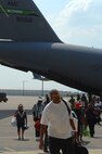 Hurricane Gustav evacuees from New Orleans step off a C-17 from McChord Air Force Base, Wash., August 31 after being transported out of harm's way. To date, Air Mobility Command units have transported more than 6,500 Gustav evacuees to safety. The evacuees were sent to different cities in Tennessee where relief teams were awaiting their arrival with food, water and shelter. 