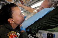U.S. Air Force Senior Master Sgt. Frances Williams helps an evacuee of Hurricane Gustav board a flight The Federal Emergency Management Agency and The Department of Defense haschartered to transport citizens to destinations safely outside the hurricanes path Lake Front Airport, New Orleans, La., Aug. 31, 2008.