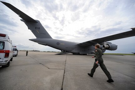 Emergency vehicles carrying evacuees of Hurricane Gustav stage near a Canadian Air Force C-17 at Lake Front Airport, New Orleans, La., Aug. 31, 2008. The Federal Emergency Management Agency and The Department of Defense chartered flights to transport citizens to destinations safely outside the hurricanes path.The Canadian Forces aircraft was brought in to help as part of the Civil Assistance Plan between the United States and Canada.
