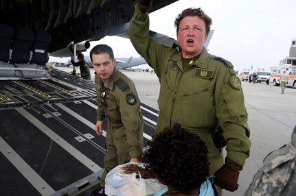 Canadian Air Force medical technician Kate Ryan helps evacuees of Hurricane Gustav to board a flight The U.S. Federal Emergency Management Agency and The Department of Defense chartered to transport citizens to destinations safely outside the hurricanes path Lake Front Airport, New Orleans, La., Aug. 31, 2008. The Canadian Forces aircraft was brought in to help as part of the Civil Assistance Plan between the United States and Canada. 