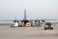 U.S. Air Force Airmen from the 37th and 59th Air Wing unload hospital patients at Lackland Air Force Base, Texas, Sept. 12, 2008, that were evacuated from Beaumont, Texas.  These patients were transported by a combined effort from the Little Rock Air Force Base C-130 aircraft and crews and the 908th Aero medical Evacuation Squadron, Scott Air Force Base, Ill., in preparation for Hurricane Ike's landfall in southern Texas.  