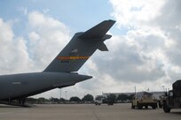 Humvees carrying humanitarian supplies are loaded into a C-17 Globemaster IIIaircraft at Kelly Air Force Base, Texas, Sept. 10, 2008, to be flown to McAllen, Texas, to prestage for possible Hurricane Ike recovery efforts. The aircraft is from the 58th Airlift Squadron at Altus Air Force Base, Okla. 