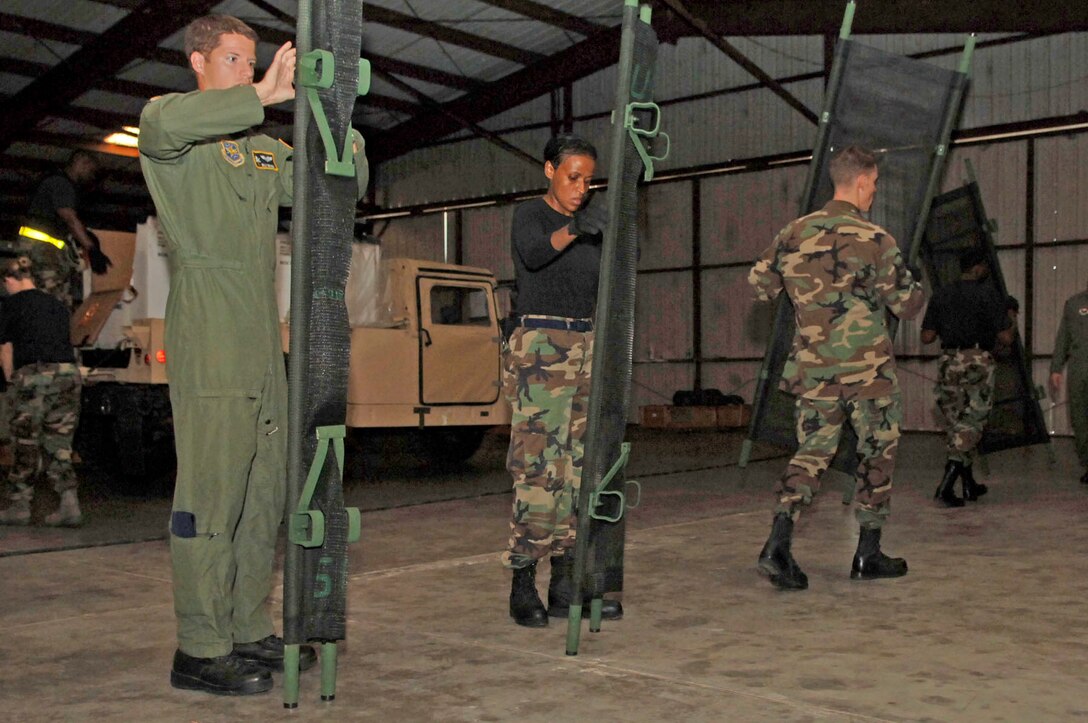 Members of a Mobile Aeromedical Staging Facility team from MacDill Air Force Base, Fla., set up litters in preparation for incoming aeromedical evacuation patients. The MASF team deployed in support of U.S. Northern Command, which is supporting federal, state and local Hurricane Ike response efforts there.