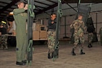 Members of a Mobile Aeromedical Staging Facility team from MacDill Air Force Base, Fla., set up litters in preparation for incoming aeromedical evacuation patients. The MASF team deployed in support of U.S. Northern Command, which is supporting federal, state and local Hurricane Ike response efforts there.