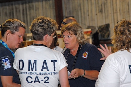 Air Force Maj. Janice McFall, Flight Doctor, 463rd Airlift Group from Little Rock Air Force Base, Ark., helps place hospital patients and nursing home residents onboard a C-130 aircraft in preparation for Hurricane Ike in Corpus Christi, Texas, Sep. 10, 2008. U.S. Northern Command is supporting federal, state and local Hurricane Ike response efforts in Texas, and aeromedical evacuation capabilities remain on alert pending FEMA requests for assistance.
