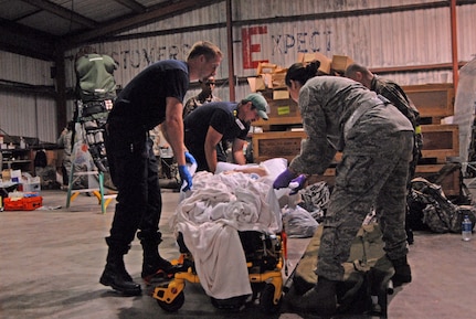 Ambulances line up in Corpus Christi, Texas, Sept. 10, 2008, in preparation for a planned aeromedical evacuation from Hurricane Ike. U.S. Northern Command is supporting federal, state and local Hurricane Ike response efforts in Texas, and aeromedical evacuation capabilities remain on alert pending FEMA requests for assistance.