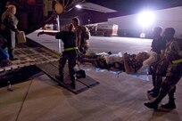 Military personnel take a medical patient to an Air Force C-130 cargo aircraft for evacuation Wednesday, Sept. 10, 2008, from Corpus Christi, Texas, to a medical facility in Dallas as Hurricane Ike approaches the Texas Gulf Coast. U.S. Northern Command is supporting federal, state and local Hurricane Ike response efforts in Texas, and aeromedical evacuation capabilities remain on alert pending FEMA requests for assistance.