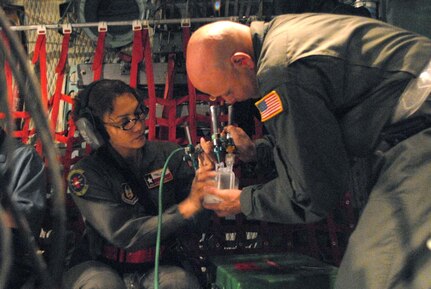 ir Force Senior Master Sgt. Rowena Sanchez-Reitan and Master Sgt. Mark Juarez, both air evacuation technicians from the 433rd Air Evacuation Squadron, asemble an oxygen system in a C-130E Hercules aircraft at Corpus Christi International Airport in Texas Sept. 11, 2008, during a planned evacuation from Hurricane Ike. U.S. Northern Command is supporting federal, state and local Hurricane Ike response efforts in Texas, and aeromedical evacuation capabilities remain on alert pending FEMA requests for assistance.