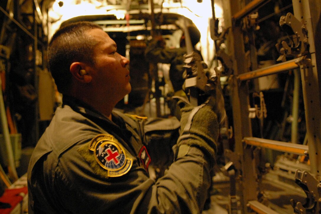 U.S. Air Force Master Sgt. Apen Phillips goes through pre-flight procedures at Little Rock Air Force Base, Ark., Sept. 12, 2008, before takeoff to Beaumont, Texas.  Phillips is part of a combined effort from the 61st Air Wing C-130 aircraft and crews Little Rock Air Force Base and the 908th Aero medical Evacuation Squadron Scott Air Force Base, Ill., that will be evacuating patients in Beaumont, Texas, to Lackland Air Force Base, Texas, in preparation for Hurricane Ike's landfall in southern Texas.  