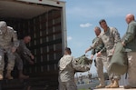 U.S. Army North personnel load their bags into a truck for transportation from Fort Sam Houston, Texas, to Camp Mabry, Texas, on Sept. 13, 2008. About 75 servicemembers and Department of Defense civilians are setting up their operational command post near the Joint Field Office just outside of Austin. U.S. Northern Command is supporting federal, state and local Hurricane Ike response efforts in Texas.