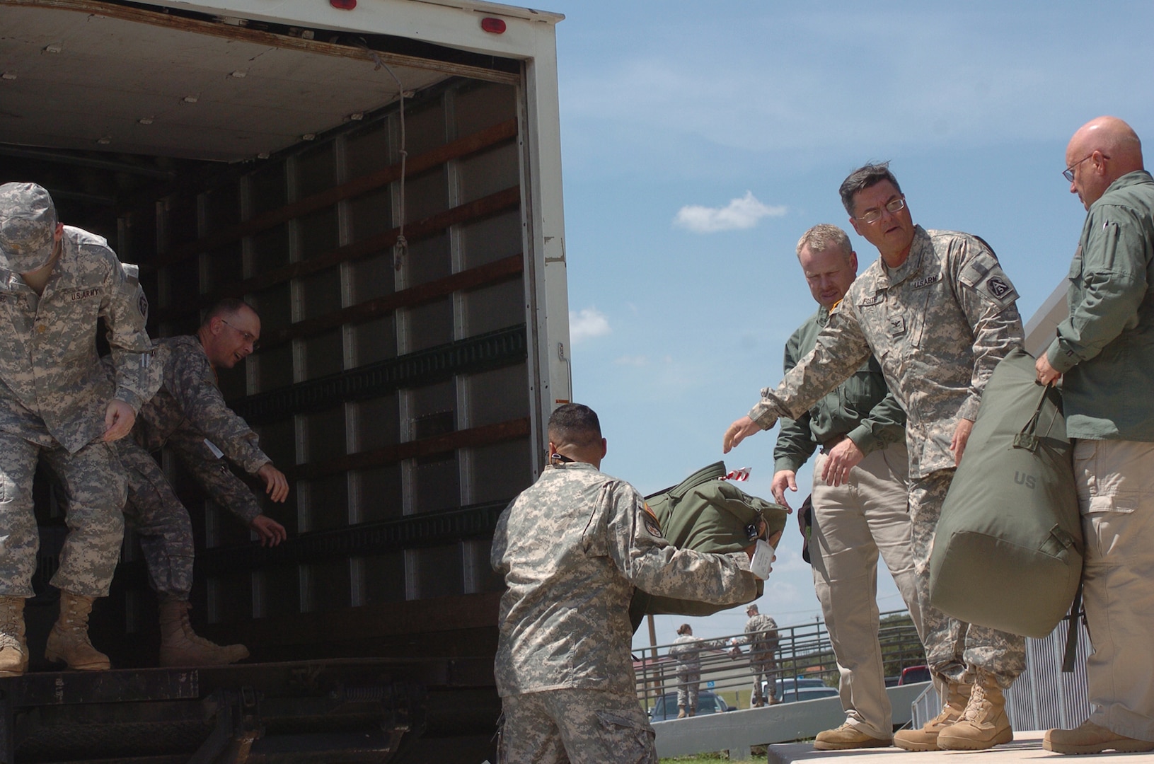 U.S. Army North personnel load their bags into a truck for transportation from Fort Sam Houston, Texas, to Camp Mabry, Texas, on Sept. 13, 2008. About 75 servicemembers and Department of Defense civilians are setting up their operational command post near the Joint Field Office just outside of Austin. U.S. Northern Command is supporting federal, state and local Hurricane Ike response efforts in Texas.