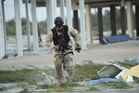 U.S. Air Force Pararescueman Staff Sgt. Lopaka Mounts, assigned to the 331st Air Expeditionary Group conducts search and rescue operations in Galveston Texas after Hurricane Ike,  September 13, 2008.  