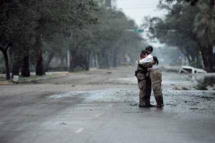 U.S. Air Force Pararescueman Staff Sgt. Lopaka Mounts, assigned to the 331st Air Expeditionary Group receives a hug from a resident during search and rescue operations after Hurricane Ike,  September 13, 2008.  