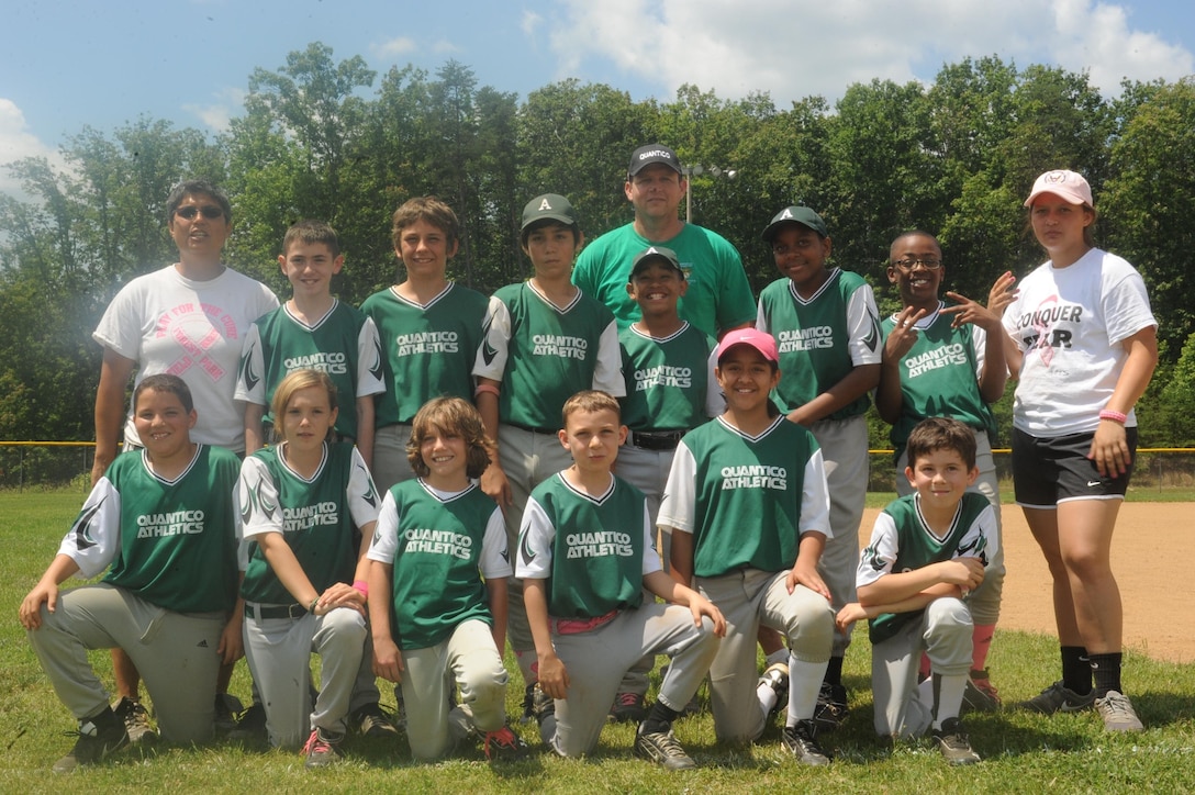 The Athletics baseball team, part of the Youth Sports League, pose for a team picture after playing the World Series aboard Marine Corps Base Quantico on June 15, 2013. The Athletics won the game making them undefeated during the 2013 season.