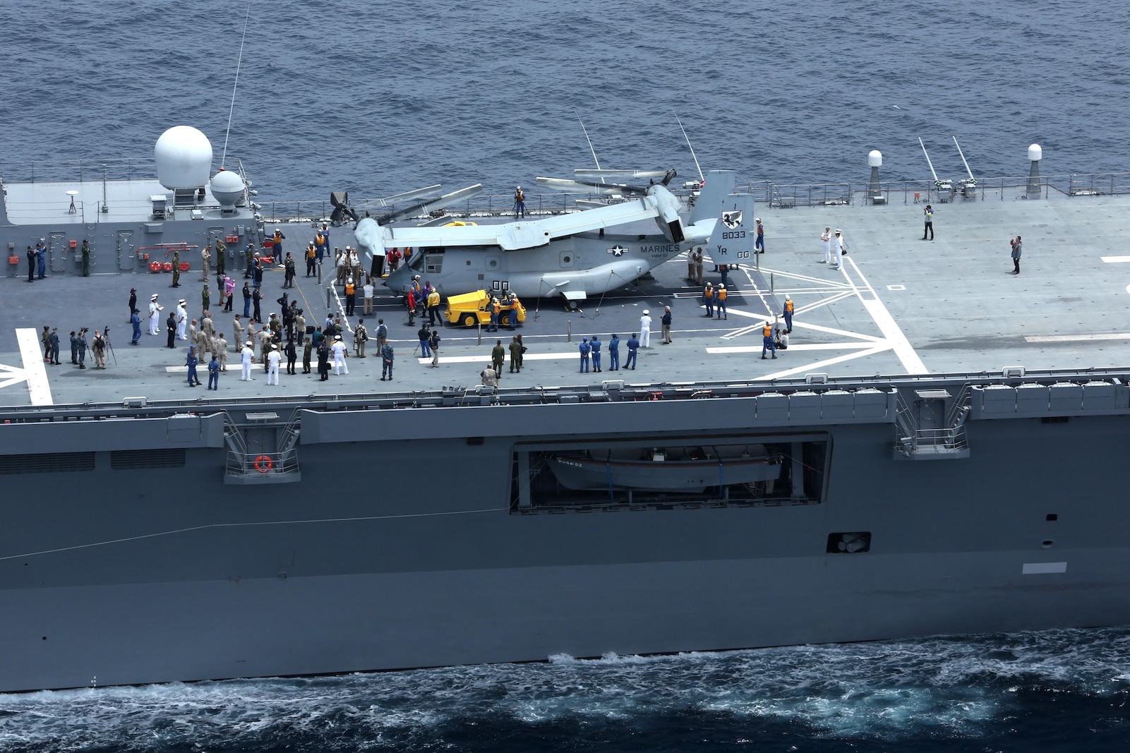 An MV-22B Osprey with Marine Medium Tiltrotor Squadron 161 sits folded aboard the JS Hyuga, ready to be taken below deck during exercise Dawn Blitz, June 14. Dawn Blitz demonstrates the unique capabilities of the Marine Corps and Navy to rapidly respond to contingencies in coordination with our coalition partners.