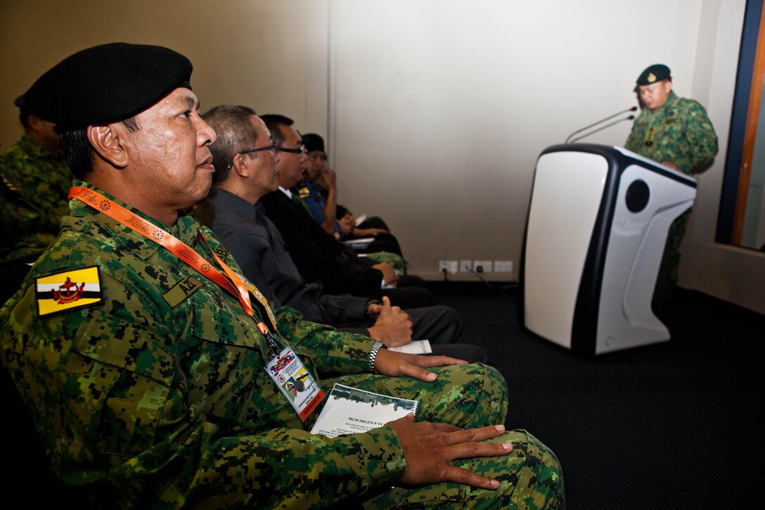 First Adm. Dato Seri Pahlawan Abdul Aziz bin Haji Mohd Tamit, along with other multinational military leaders, attend the opening ceremony to the Association of Southeast Asian Nations Humanitarian Assistance/Disaster Relief and Military Medicine Exercise (AHMX) at the Multinational Coordination Centre in Muara, Brunei Darussalam, June 17. AHMX is a multilateral exercise that provides a platform for regional partner nations to address shared security challenges, strengthen defense cooperation, enhance interoperability and promote stability in the region. Aziz is the Joint Force commander, Royal Brunei Armed Forces.