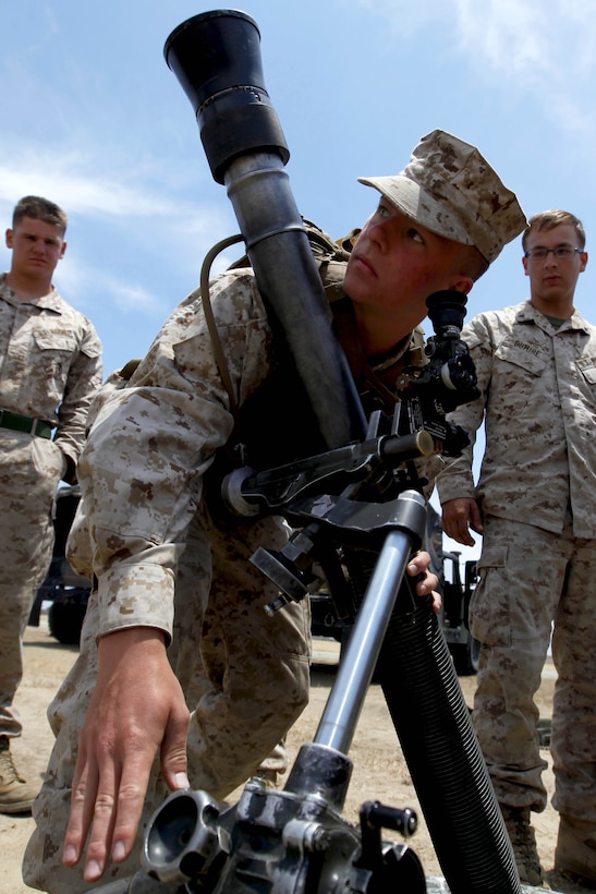 Midshipman 3rd Class Ty Gunnlaugsson adjusts an 81-millimeter mortar cannon during Marine Week of Career Orientation and Training for Midshipmen-West 2013 here June 12. Future officers from across the U.S. participated in the four-weeks of training designed to introduce them to career opportunities.