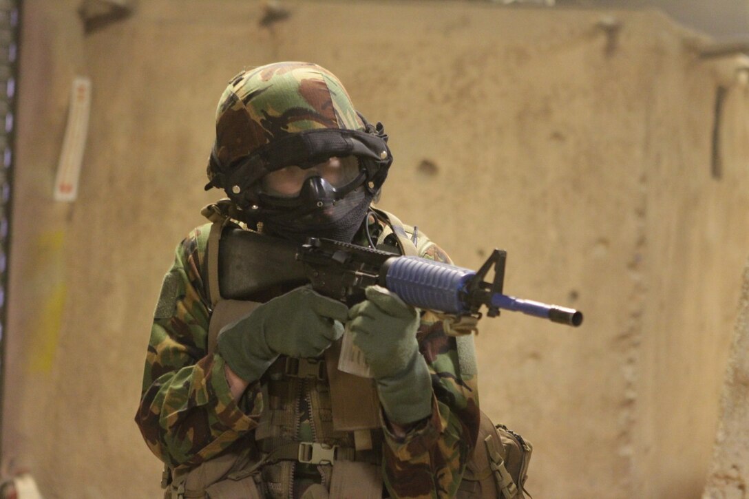 A New Zealand Army soldier provides security at the Infantry Immersion Trainer here during Exercise Dawn Blitz 2013, June 13. The IIT gave the New Zealander's a taste of what they might encounter in future combat operations. Dawn Blitz 2013 is a scenario-driven exercise designed to test Navy and Marine Corps forces at the Marine Expeditionary Brigade (MEB) and Expeditionary Strike Group (ESG) level, while promoting military-to-military cooperation and interoperability with partnered nations.