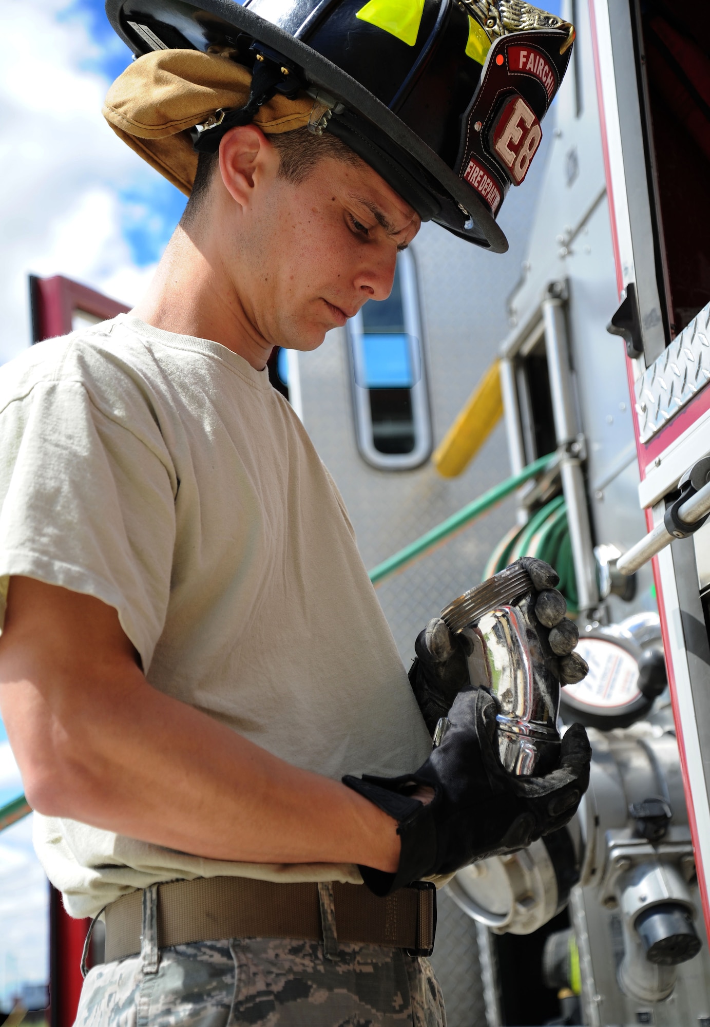 Senior Airman Alberto Garcia-Vidal, 92nd Civil Engineer Squadron firefighter, inspects all equipment carried on the P-24 Engine 8 firefighting vehicle during an operational inspection at Fairchild Air Force Base, Wash., June 12, 2013. Garcia-Vidal performs a daily apparatus checkout by checking all the tools and equipment for discrepancies. (U.S. Air Force photo by Airman 1st Class Janelle Patiño/Released)