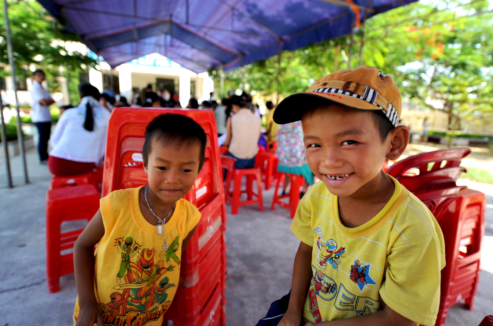 Children and their families from the Quang Binh Province, wait to be seen at the Health Service Outreach site during Operation Pacific Angel 13-3 in Dong Hoi, Quang Binh Province, Vietnam, June 15, 2013. Dental services and optometry were some of the various medical services offered as part of the HSO program during the reoccurring humanitarian mission. Operation PACANGEL is a joint and combined humanitarian assistance exercise held in various countries several times a year and includes medical, dental, optometry, engineering programs and a variety of subject-matter expert exchanges. (U.S. Air Force photo by Staff Sgt. Sara Csurilla)