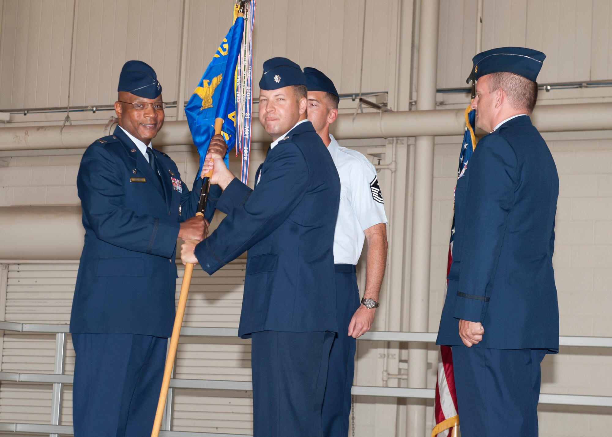Lieutenant Col. Anthony Nance, 49th Aircraft Maintenance Squadron outgoing commander, relieves command of the 49th Aircraft Maintenance Squadron during a change of command ceremony at Holloman Air Force, N.M., June 14.  As the commander, Nance was responsible for the morale, welfare, training and discipline of more than 300 personnel. His squadron maintained 24 combat ready F-22 raptors in support of the 7th Fighter Squadron’s taskings. (U.S. Air Force photo by Airman 1st Class Daniel E. Liddicoet/Released)