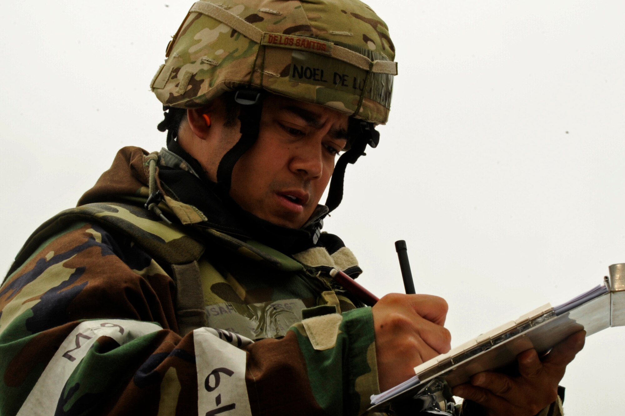 U.S. Air Force Tech. Sgt. Noel De Los Santos, 35th Aircraft Maintenance Squadron crew chief, marks tasks completed on the flightline during the second phase of the operational readiness exercise at Misawa Air Base, Japan, June 17, 2013. Phase II of the ORE was engineered to test Airmen on their readiness capabilities and survival techniques in a deployed environment. (U.S. Air Force photo by Airman 1st Class Kenna Jackson)
