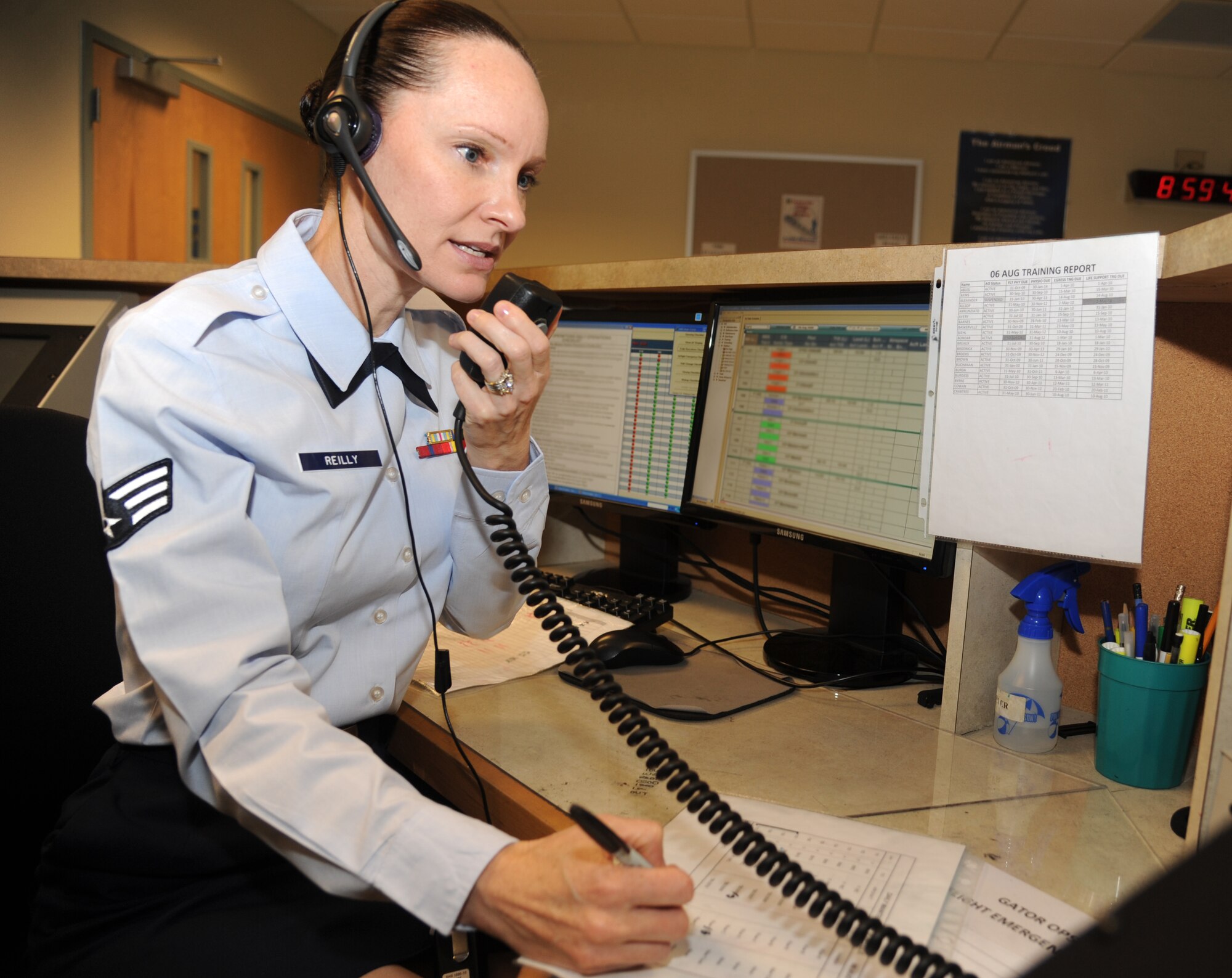 Senior Airman Kimberly Reilly, 334th Training Squadron, executes the daily flight schedule during class June 17, 2013, at Cody Hall, Keesler Air Force Base, Miss.  Reilly, a reservist with the 53rd Weather Reconnasaince Squadron, Keesler AFB, graduates June 20, with perfect scores in the aviations resource management course.  (U.S. Air Force photo by Kemberly Groue)