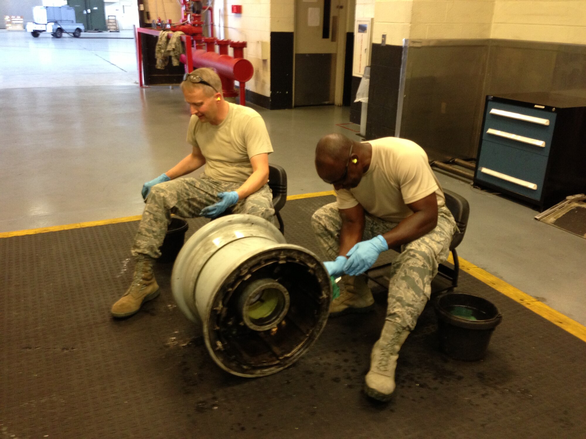 Col. Darren Hartford, 437th Airlift Wing commander, and Col. Dennis Dabney, 437th Maintenance Group commander, visited the 437th Maintenance Squadron Wheel and Tire shop, June 13, 2013, at Joint Base Charleston – Air Base, S.C. Hartford and Dabney pitched in to help perform maintenance on C-17 wheel assemblies. (U.S. Air Force photo/ Master Sgt. Robert Wilkinson)
