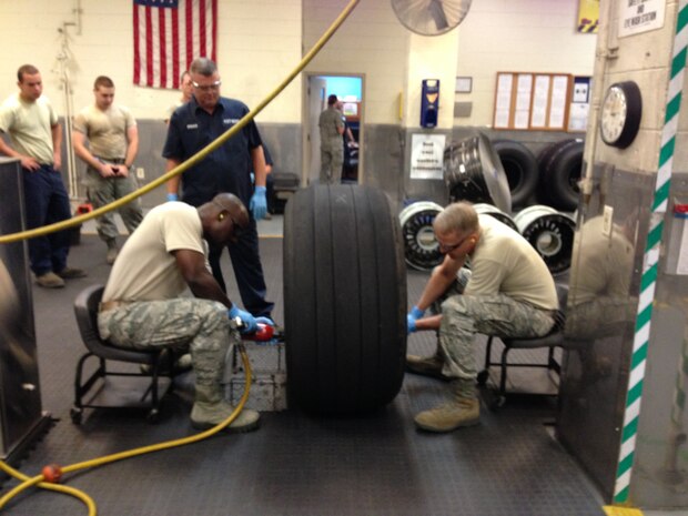 Col. Darren Hartford, 437th Airlift Wing commander, and Col. Dennis Dabney, 437th Maintenance Group commander, visited the 437th Maintenance Squadron Wheel and Tire shop, June 13, 2013, at Joint Base Charleston – Air Base, S.C. Hartford and Dabney pitched in to help perform maintenance on C-17 wheel assemblies. (U.S. Air Force photo/ Master Sgt. Robert Wilkinson)