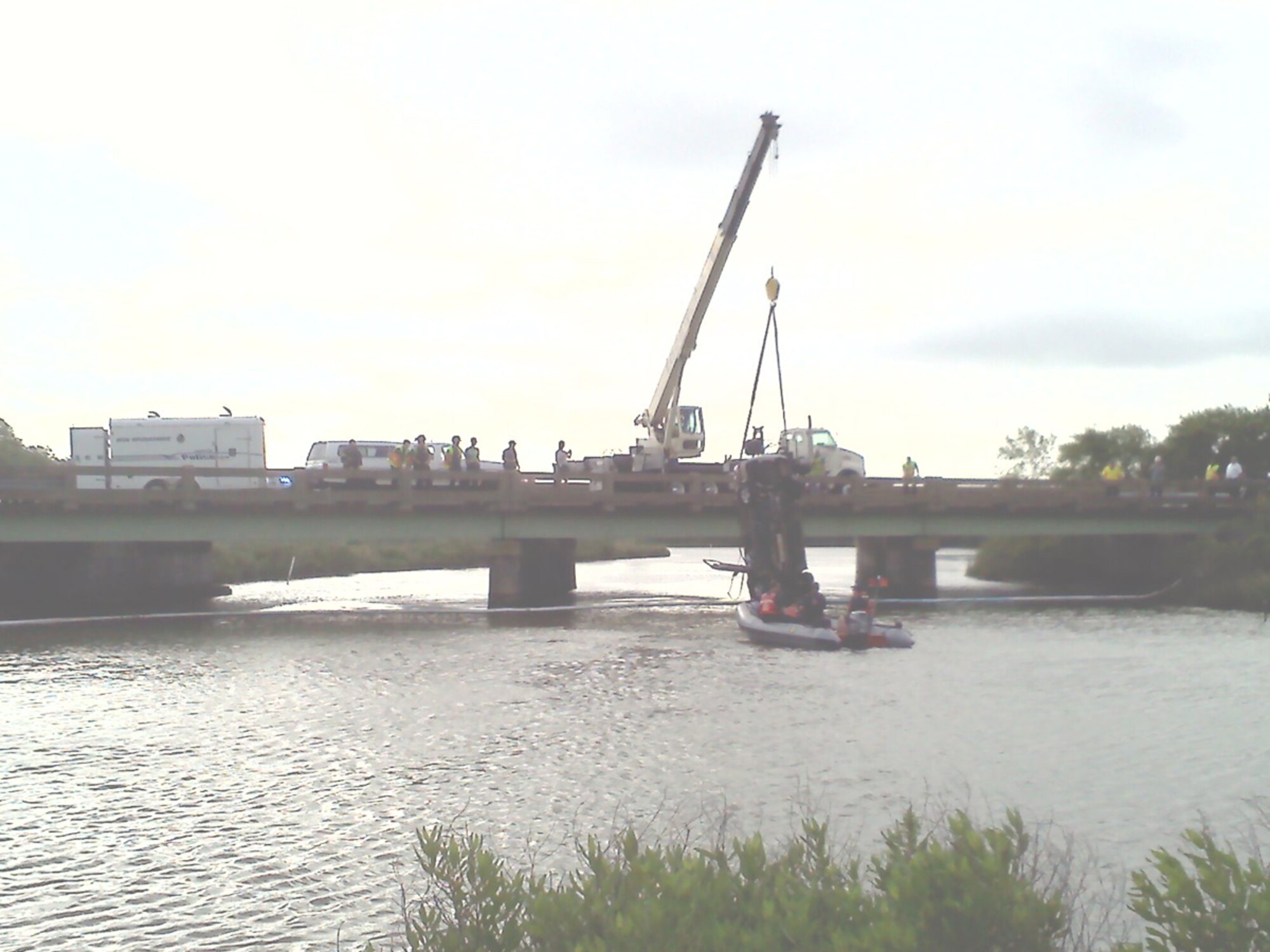 Bill Leath took this photograph of emergency crews pulling Dorothea Allen-Riley's car out of Newmarket Creek. Allen-Riley crashed into the creek after losing control of her car on Lasalle Avenue. (Courtesy photo/Released)
