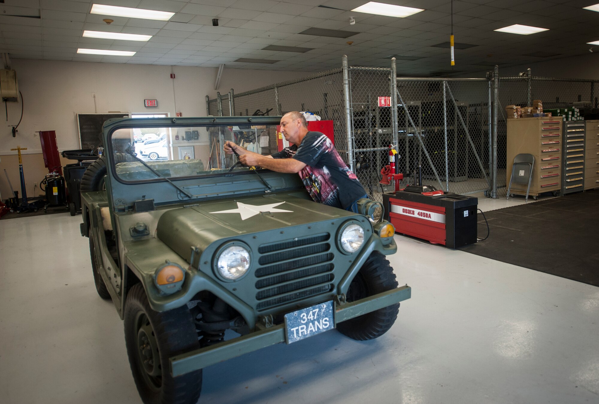 John Zakar, 23d Logistics Readiness Squadron service writer, checks the wipers on a 1967 jeep May 31, 2013 at Moody Air Force Base, Ga. Zakar considers the relic a symbol of days gone by. (U.S. Air Force photo by Airman 1st Class Sandra Marrero/released)   
