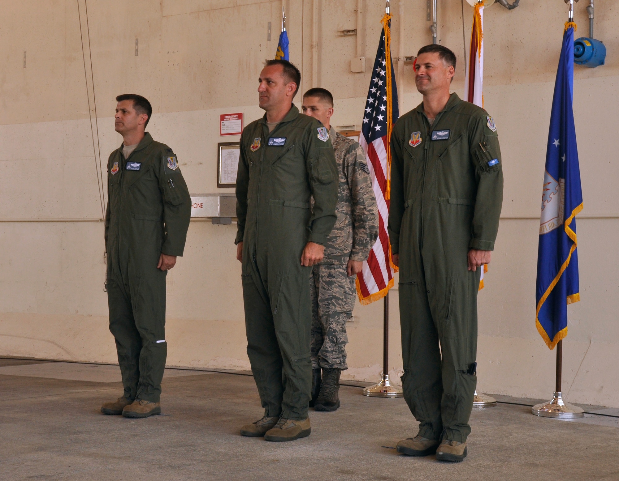 [From left] Col. Brian Simpler, commander of the Florida Air National Guard’s 125th Fighter Wing out of Jacksonville International Airport, Jacksonville, Fla., Lt. Col. James Spooner, previous 125th FW, Detachment 1, commander, and Maj. Adam Langton, new 125th FW, Detachment 1, commander, stand at attention during a change of command ceremony at Homestead Air Reserve Base, Fla., June 14. Langton, previously the Director of Operations for Detachment 1, replaces Spooner, who has been the Detachment 1 commander for the last 31 months. (U.S. Air Force photo/Senior Airman Jaimi Upthegrove)