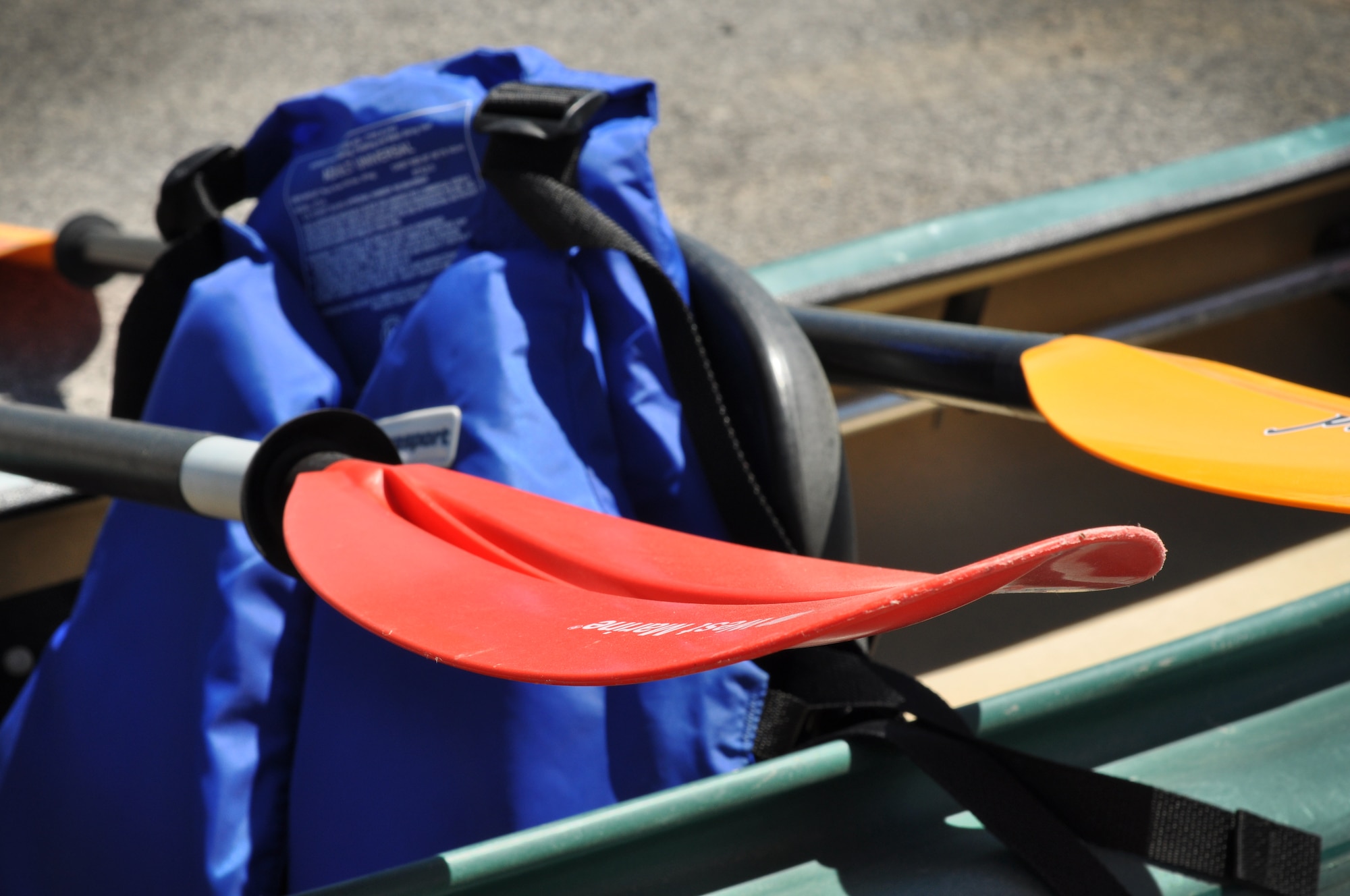 Canoes and paddles sit are displayed outside of the Outdoor Recreational building. With warmer weather on the horizon, The Outdoor Recreation program at the Niagara Falls Air Reserve Station offers a variety of equpiment to rent for various summertime activities. (U.S. Air Force photo by Staff Sgt. Sephanie Clark)
