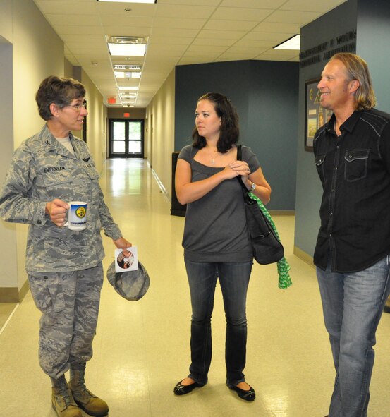 Col. Caroline Evernham, 916th Operations Group commander, shares laughs with country artist  Ansel Brown during his visit here. (USAF photo by Maj. Shannon Mann, 916ARW/PA)