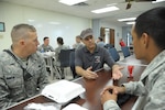 U.S. Air Force Senior Airman Justin Rankin and Airman 1st Class Jose Martinez, 902nd Security Forces Squadron, speak to Chief Master Sgt. Brian Livingston, 359th Medical Group June 7 at Joint Base San Antonio-Randolph.  (U.S. Air Force photo by Joel Martinez/Released)