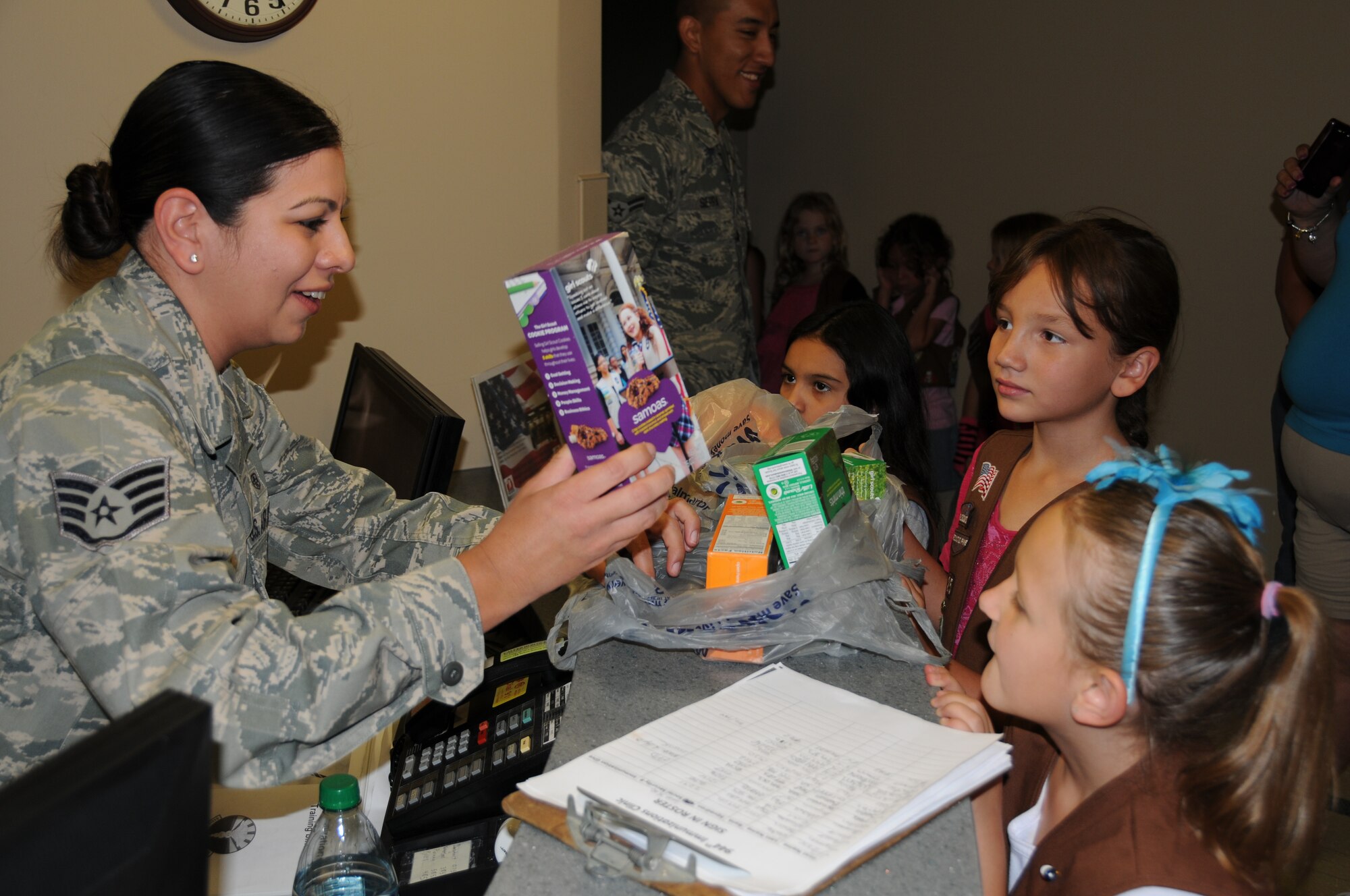Staff Sgt. Iris Rodriguez, 944th Medical Squadron assistant NCOIC of immunizations, selects some Girl Scout cookies.  Girl Scout Troop 425 Arizona Cactus Pine visited 944th Fighter Wing members during the June UTA to hand out cookies. (U.S. Air Force photo/Staff Sgt. Josh Nason) 