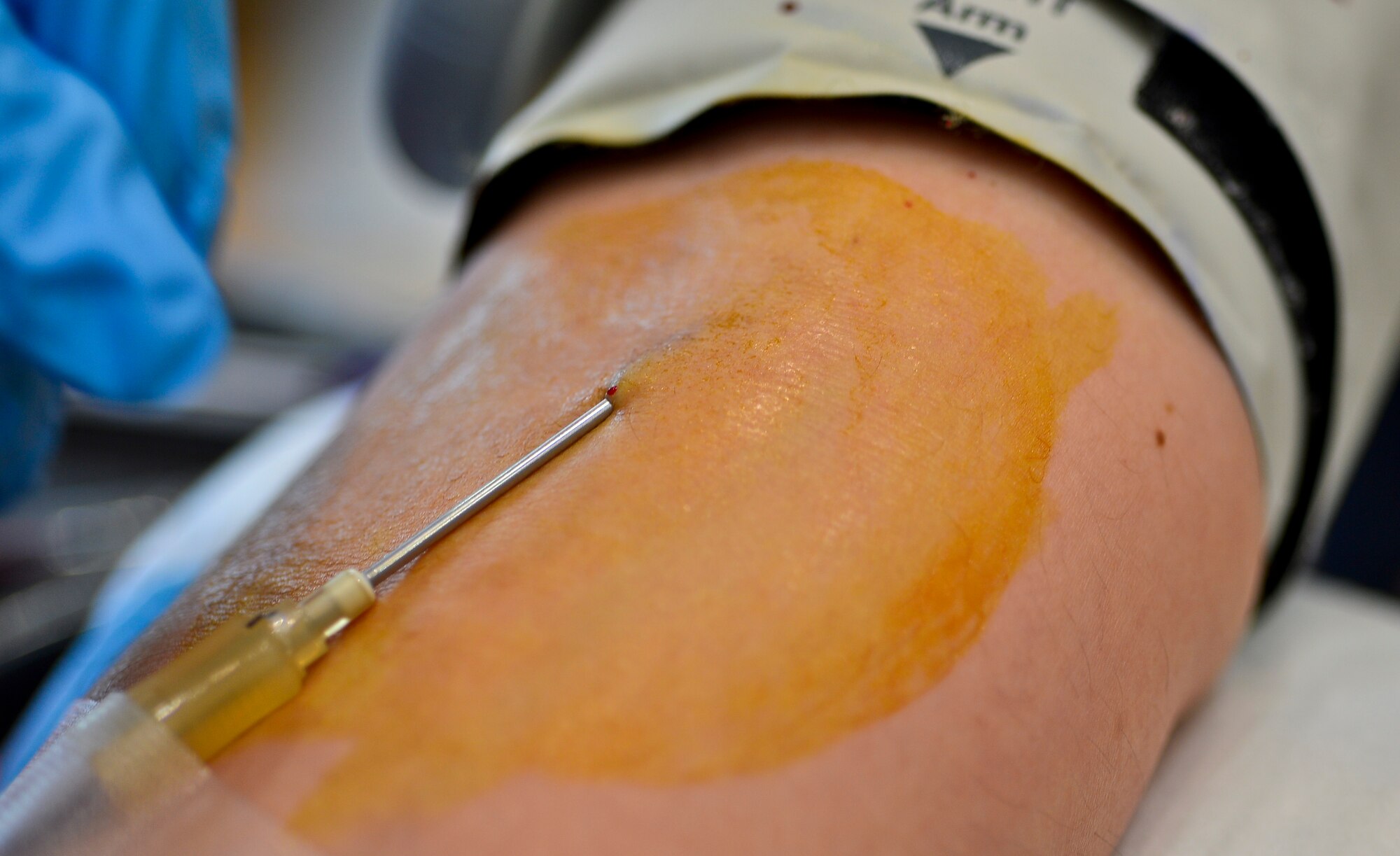 Staff Sgt. Jennifer Kellar, 786th Force Support Squadron retirement and separations NCOIC, donates blood to the Armed Services Blood Program, Ramstein Air Base, Germany, June 11, 2013. The ASBP is a blood collection and distribution service solely for the men and women who defend our country. (U.S. Air Force photo/Airman 1st Class Jordan Castelan)