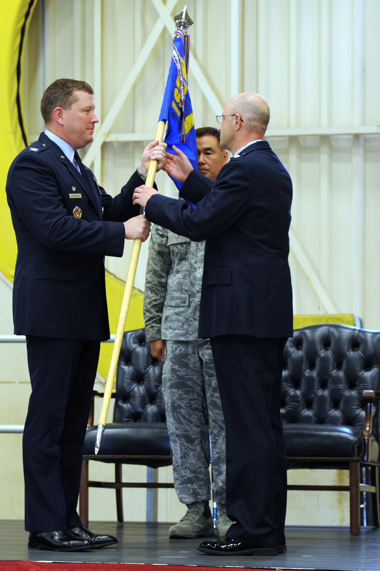 Lieutenant Col. Michael C. Edwards, right, takes the 1st Special Operations Support Squadron guidon during a change of command ceremony at the 15th Aircraft Maintenance Unit hangar on Hurlburt Field, Fla. June 7, 2013.“This squadron is the finest OSS in the Air Force, and I am humbled to have the opportunity to serve as your commander,” said Edwards. (U.S. Air Force photo by Senior Airman Kentavist P. Brackin)  