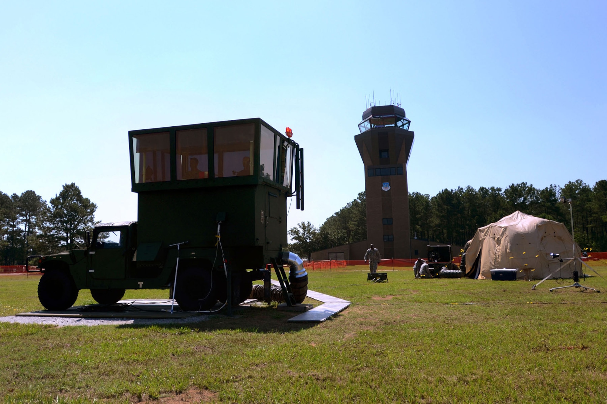 U.S. Air Force air traffic controllers with the 245th Air Traffic Control Squadron at McEntire Joint National Guard Base, South Carolina Air National Guard, work with their mobile tower at Shaw Air Force Base in Sumter, S.C., alongside personnel from the 20th Operations Support Squadron, June 13, 2013. The 245th sent a team of ATCS personnel to Shaw to set up and train Shaw's controllers on operating the mobile tower while renovations are being made to their control tower. (U.S. Air National Guard photo by Tech. Sgt. Caycee Watson/Released)