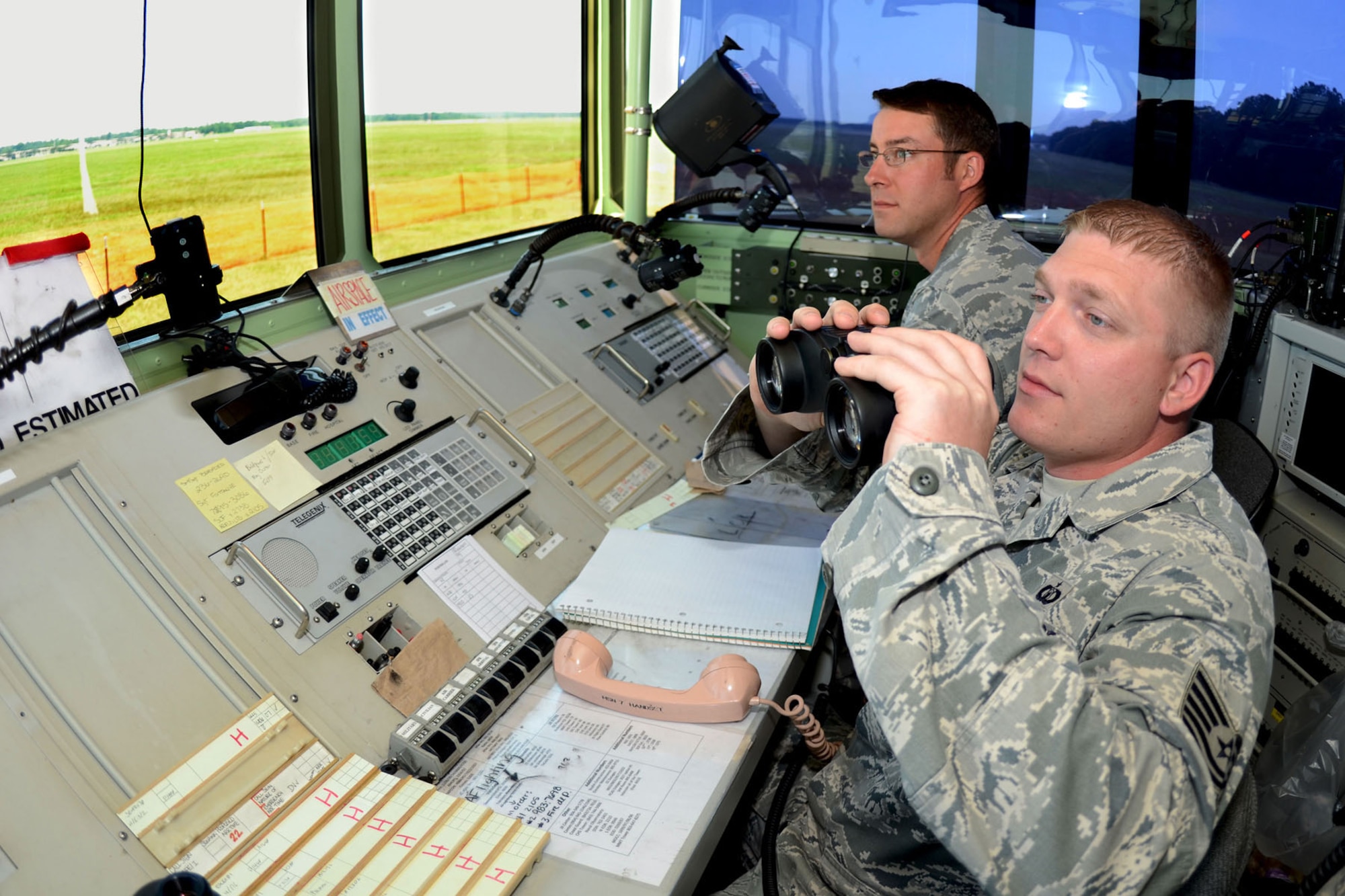 U.S. Air Force Tech. Sgt. David Kaylor, an air traffic controller with the 245th Air Traffic Control Squadron at McEntire Joint National Guard Base, South Carolina Air National Guard, works in the 245th's mobile tower set up at Shaw Air Force Base in Sumter S.C., with Tech. Sgt. Keith Wilbur, air traffic control watch supervisor with the 20th Operations Support Squadron at Shaw AFB, June 13, 2013. The 245th sent a team of ATCS personnel to Shaw to set up and train Shaw's controllers on operating the mobile tower while renovations are being made to their control tower. (U.S. Air National Guard photo by Tech. Sgt. Caycee Watson/Released)