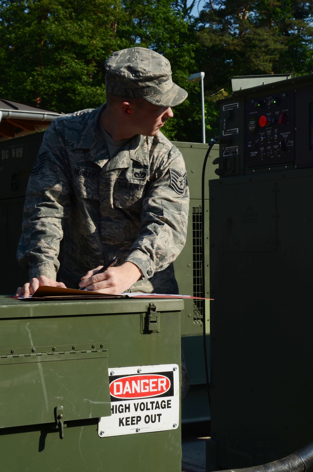 Tech. Sgt. Richard Nunley, 1st Combat Communications Squadron technician, inspects a generator providing continuous power to the 603rd Air and Space Operation Center during an upgrade to its main power systems, June 8, 2013, Ramstein Air Base, Germany.  The 1st CBCS supported the 603rd AOC with 24-hour manning from June 6 through 8 providing uninterrupted communications with operations in Europe and Africa. (U.S. Air Force photo / 1st Lt. Kay M. Nissen)