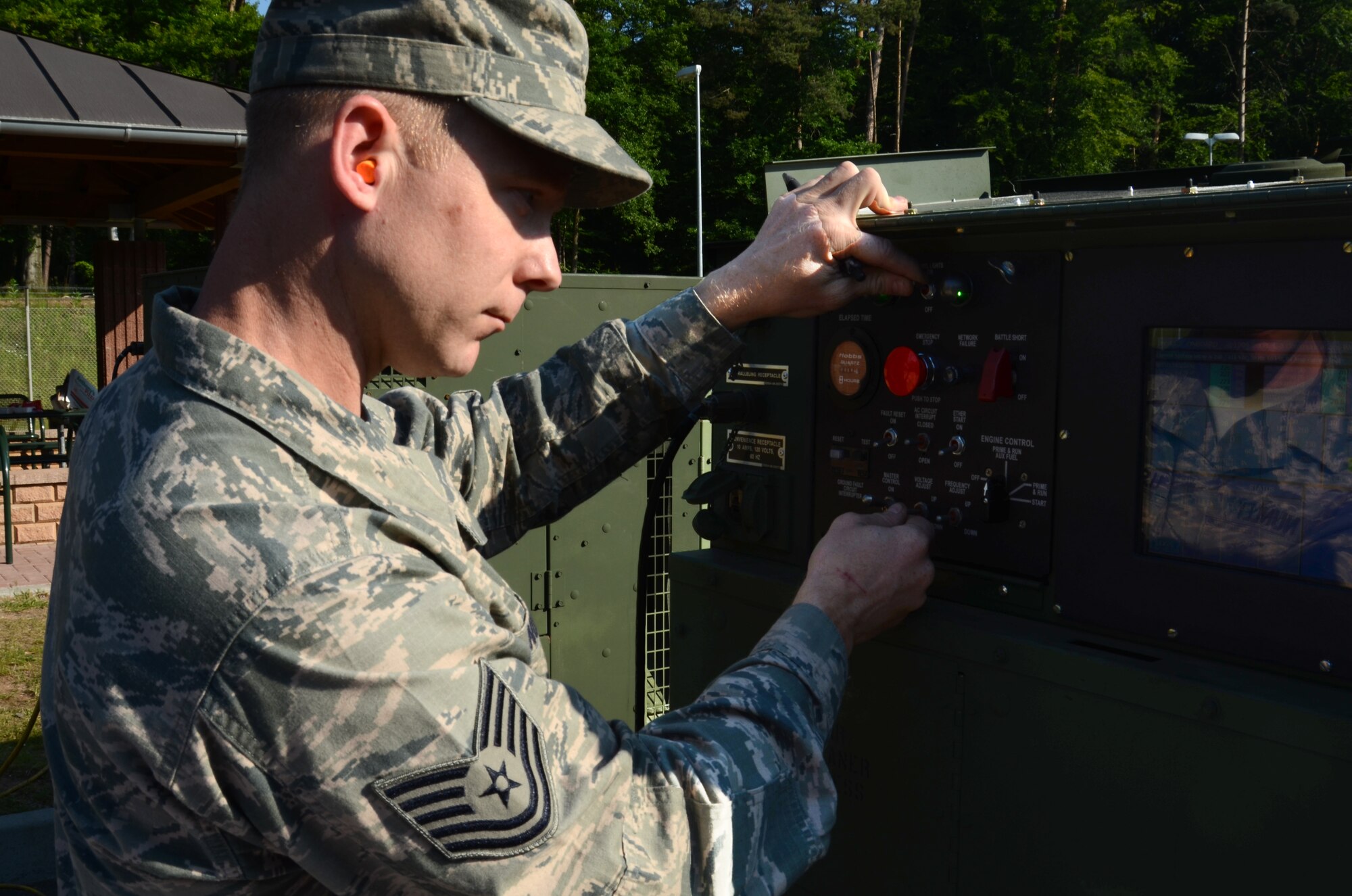 Tech. Sgt. Richard Nunley, 1st Combat Communications Squadron technician, inspects a generator providing continuous power to the 603rd Air and Space Operation Center during an upgrade to its main power systems, June 8, 2013, Ramstein Air Base, Germany.  The 1st CBCS supported the 603rd AOC with 24-hour manning from June 6 through 8 providing uninterrupted communications with operations in Europe and Africa. (U.S. Air Force photo / 1st Lt. Kay M. Nissen)