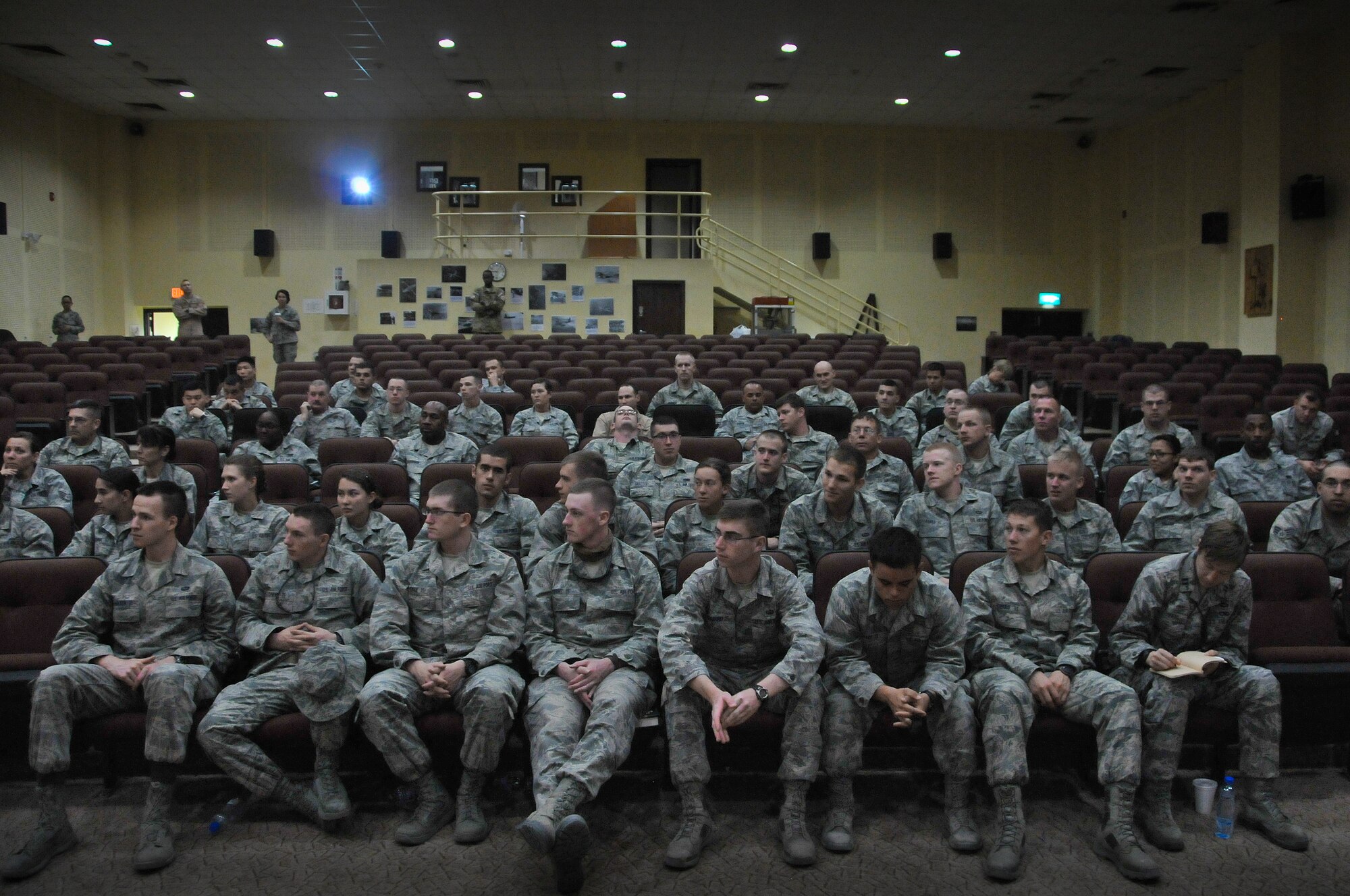 A group of Airmen listen to their "Right Start" briefing shortly after their arrival their deployed location Tuesday, June 11, 2013.   (U.S. Air Force photo by 1st Lt. Nathan Wallin)   
