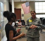 Air Force Reserve Tech. Sgt. Holliane Palcic,  an aviation resource manager with the 910th Operations Support Squadron, interacts with a student during a classroom exercise at Warren G. Harding High School in Warren May 17, 2013. U.S., Air Force photo/Maj. Brent J. Davis