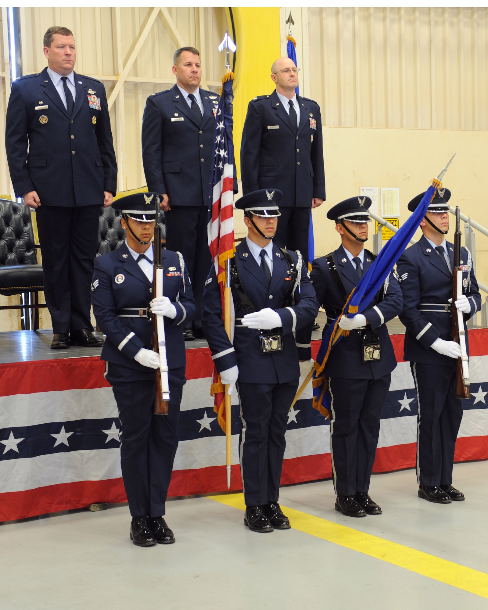 Color Guard Airmen present the flags during the 1st Special Operations Support Squadron change of command ceremony at the 15th Aircraft Maintenance hangar on Hurlburt Field, June 7, 2013. Lieutenant Col. Jeremy D. Kokenes relinquished command of 1st Special Operations Support Squadron to Lt. Col. Michael C. Edwards during the ceremony and bid the squadron farewell. (U.S. Air Force photo by Senior Airman Kentavist P. Brackin)  