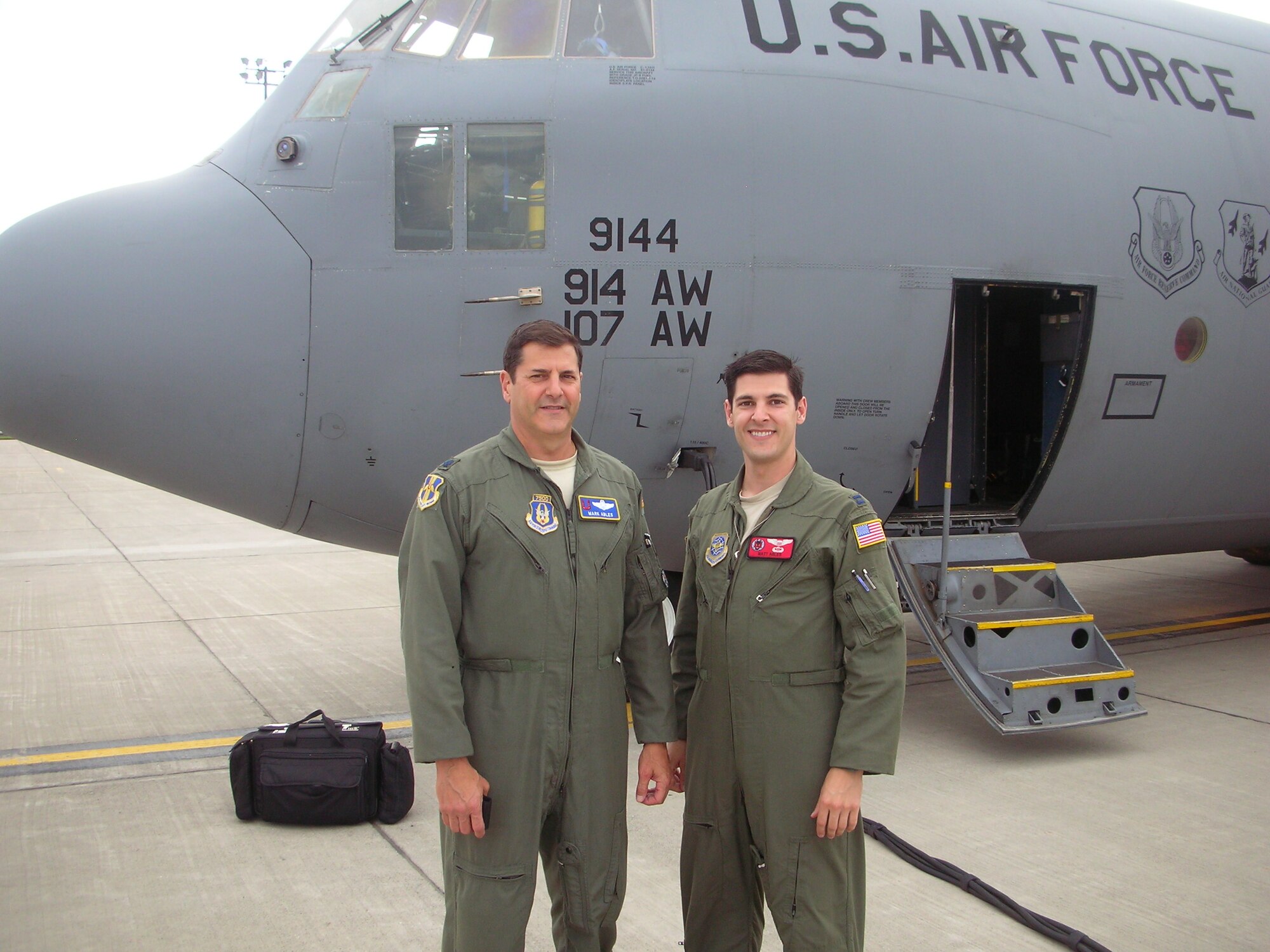 Lt. Col Mark Ables, (left) poses with his son, Capt. Matthew Ables prior to their first flight together as U.S. Air Force Commissioned Officers, June 13, 2013. As the two pilots progressed in their careers, they have flown the same planes at different times, until today. (Courtesy Photo by Lt. Col Mark Ables.)