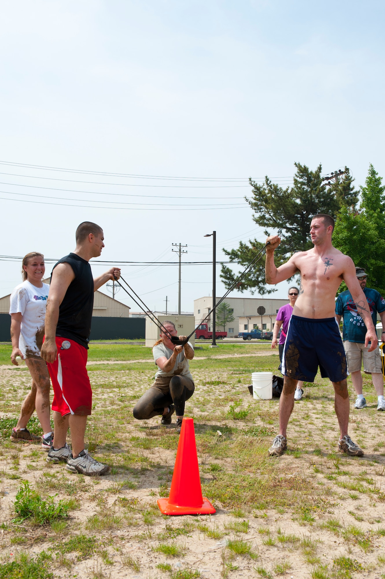8th Fighter Wing Airmen sling water balloons during a challenge for the Wolf Pack Warrior Mud Run at Kunsan AB, Republic of Korea, June 8, 2013. This was one of nine obstacles participants had to complete during the 1.88 mile mud run. (U.S. Air Force photo by Staff Sgt. Jonathan Fowler/Released)