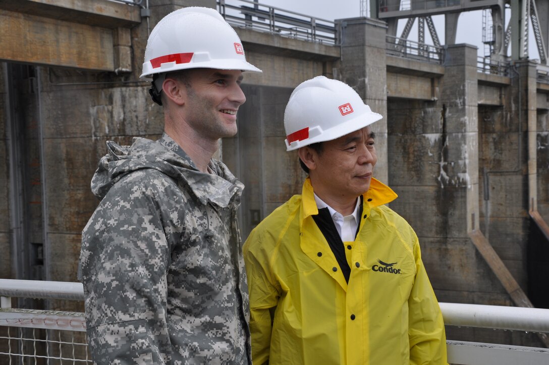 Lt. Col. Patrick Dagon, left, U.S. Army Corps of Engineers Nashville District deputy commander stands with Cheng Guo-Qiang, secretary-general and senior fellow, Academic Committee, Development Research Center of the State Council of the Peoples Republic of China during a Chinese delegation visit to Chickamauga Lock, Chattanooga, Tenn., June 7, 2013. 
