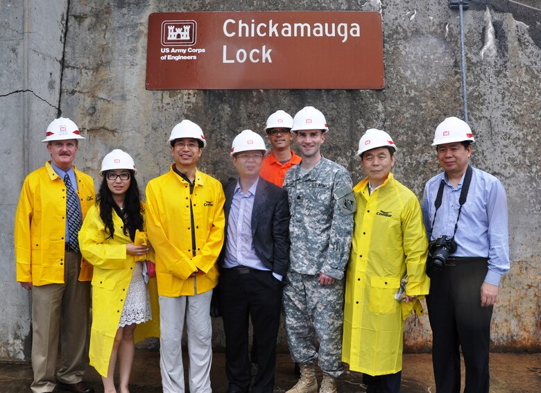 Officials from China’s Three Gorges Corporation and Project Construction Committee pose for a photograph after briefings on navigation lock construction, operations, maintenance and agency partnerships by U.S. Army Corps of Engineers Nashville District personnel and a tour of  Chickamauga Lock June 7, 2013. From left, Jamie James, Nashville District project manager, New Chickamauga Lock; Qiu Shuang, translator; Zhou Xianzheng, director, Technology and Equipment Division; Cao Guangrong, deputy director, Construction and Operation Management Bureau; Alex Wyss, Knoxville Nature Conservancy; Lt. Col. Patrick Dagon, Nashville District deputy commander; Cheng Guo-Qiang, secretary-general, Development Research Center, State Council, Peoples Republic of China; and Xu Chuanzhou, senior engineer, Three Gorges Construction and Operation Management Bureau.